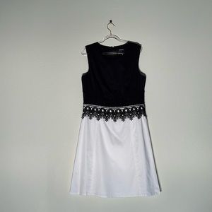 A DKNY black and white dress with lace detailing